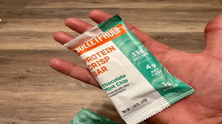 Our tester holds a chocolate mint chip Bulletproof Protein Crisp Bar