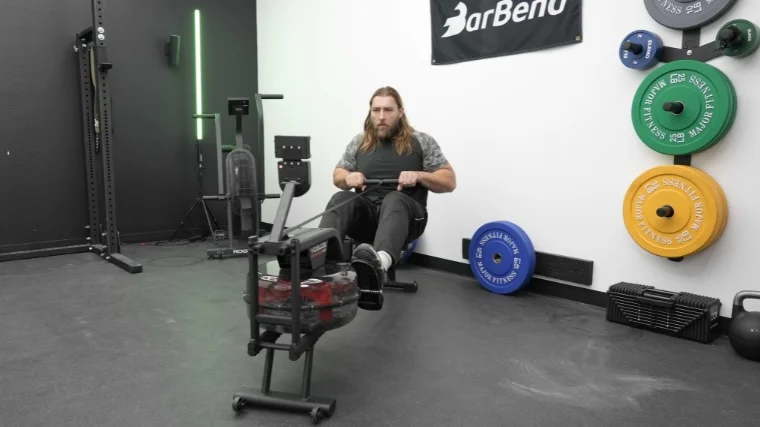 Our tester works out on the Yosuda Rower.