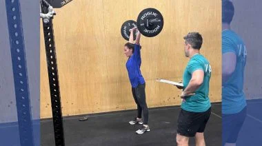 Emily Beers is shown lifting weights