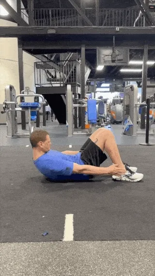 A person doing heel touches.