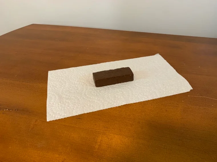 A Pure Protein protein bar on a paper towel.