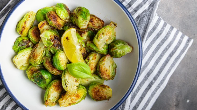 A bowl of brussels sprout on the table.