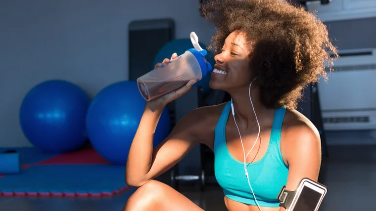 woman chugging shaker bottle