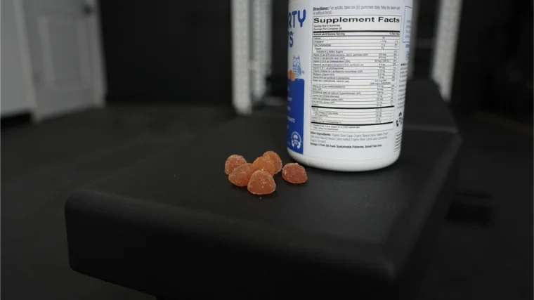 SmartyPants Adult Complete gummies next to bottle. 