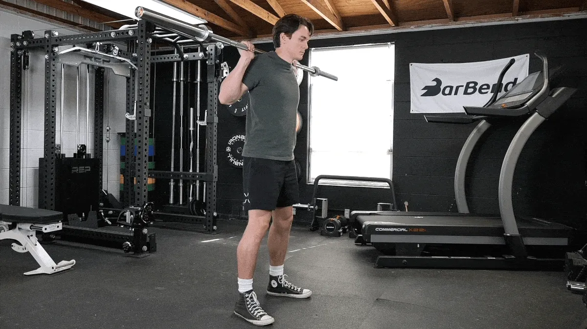 A person doing the kang squat.