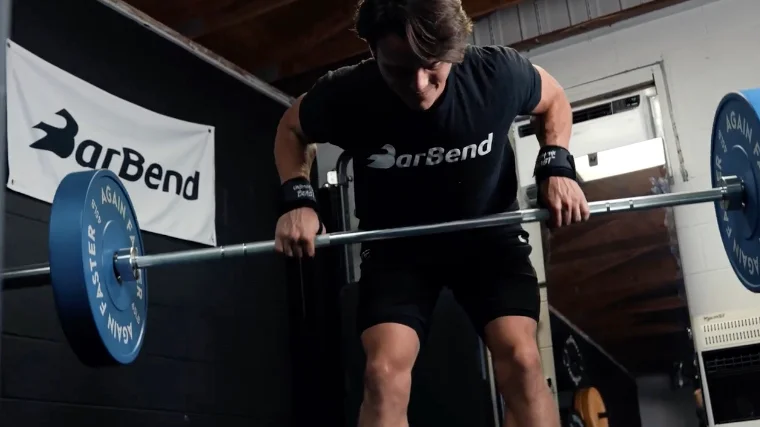 doing rows with the again faster pursuit olympic bar