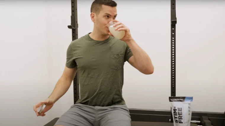 A BarBend tester drinking Transparent Stim-Free pre-workout.