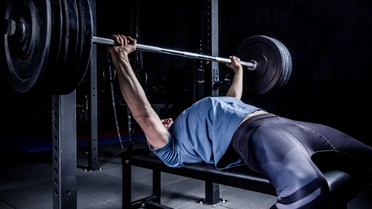 Man performing bench press