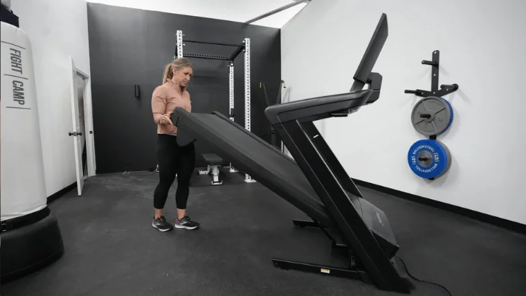 Our tester folding the NordicTrack Commercial 2450.