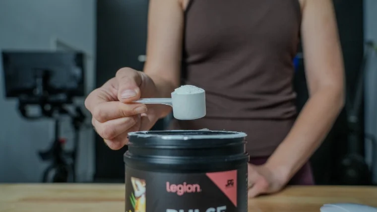Our tester scooping a serving of Legion Pulse pre-workout