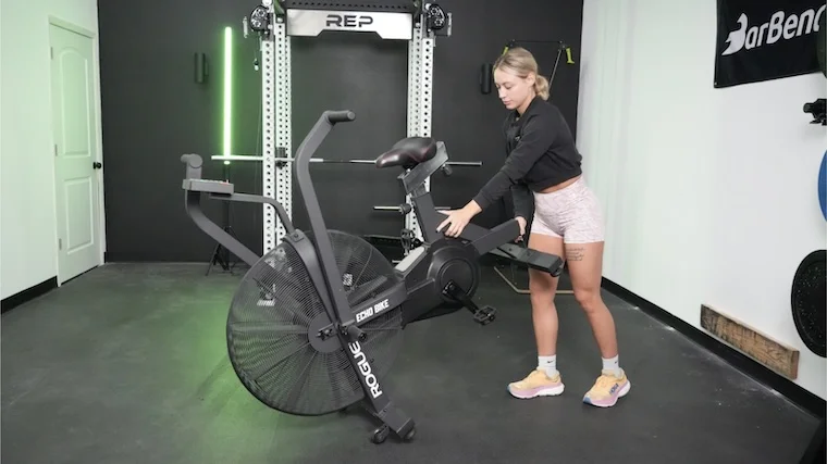 rouge-echo-air-bike-moving-bike Our tester moving the Rogue Echo Air Bike into position for a workout