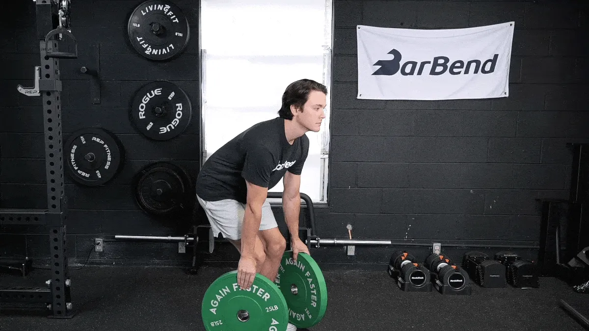 BarBend's Jake Herod doing the plate pinch exercise.