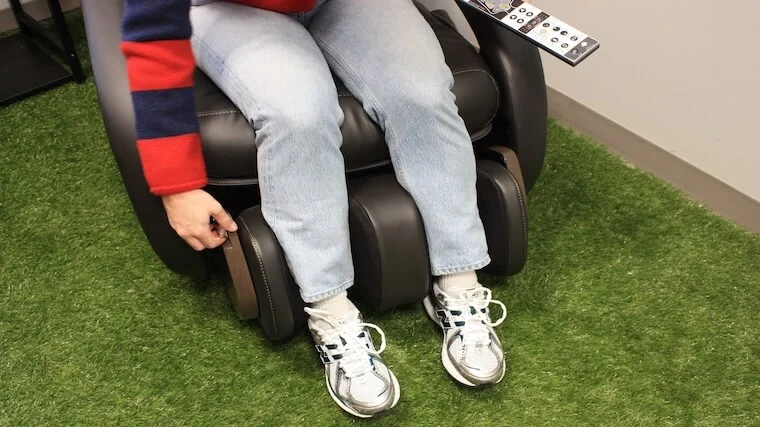 Our tester adjusting the calf massage unit featured on the Human Touch WholeBody 8.0