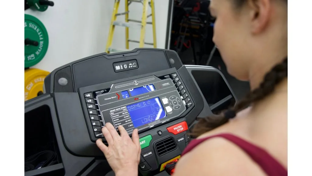 bowflex bxt8j close up pressing button on controls