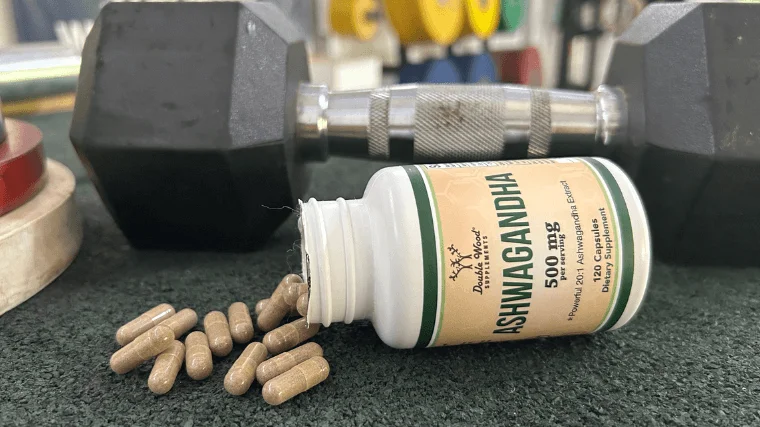 double wood ashwagandha capsules beside bottle