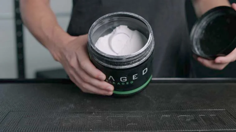 A container of Kaged Pre-Kaged Pre-Workout Powder.