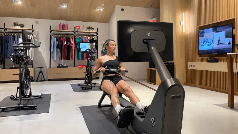 peloton-row-woman-tests A woman uses the Peloton Row at a Peloton showroom.