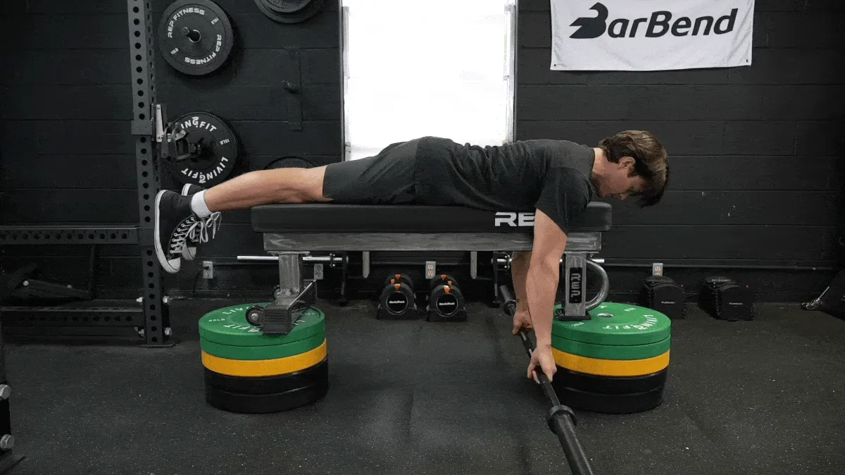 A person doing the seal row exercise.