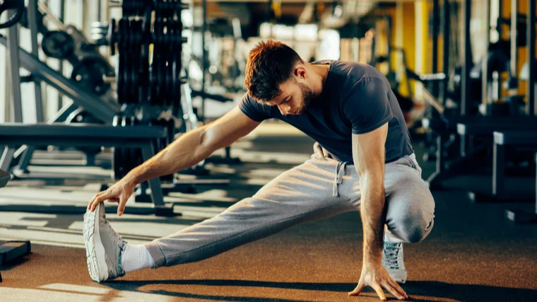 man warming up hamstrings