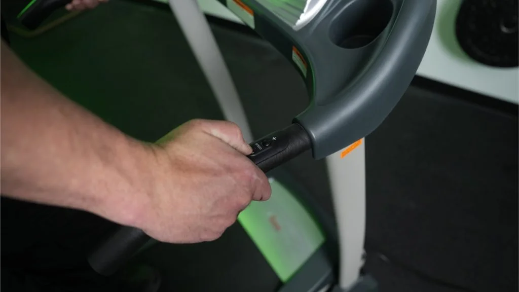 sunny health and fitness tf 4400 close up pressing speed button on side handle bar
