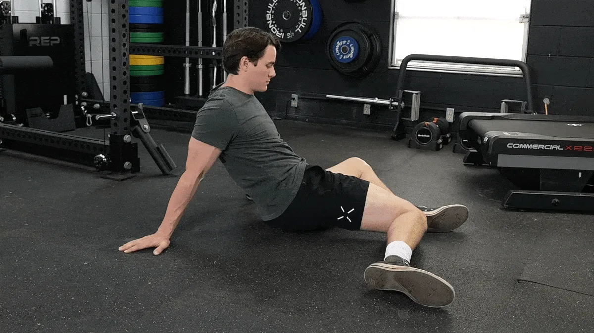 A person doing the 90/90 hip rotation.