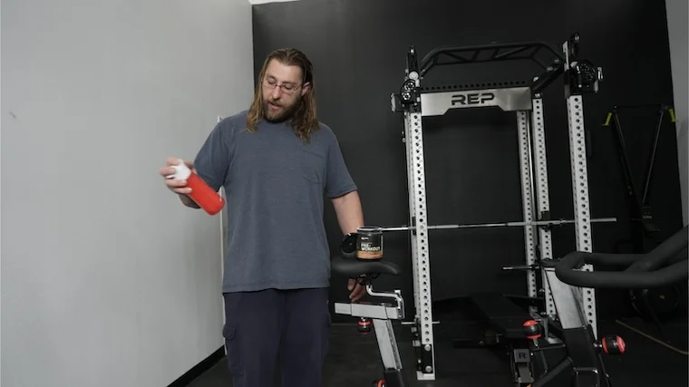 Our tester mixing a shaker of Optimum Nutrition Gold Standard Pre-Workout