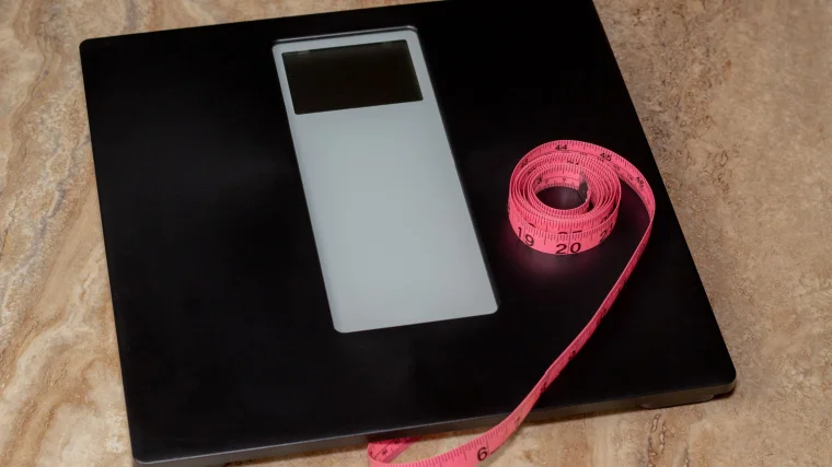 A weighing scale and a measuring tape.