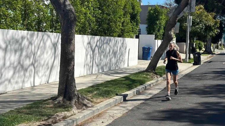 Our tester running with the Lululemon Down for it All vest.