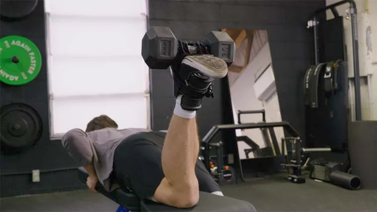 Jake doing Lying Leg Curls with the MonkeyFeet