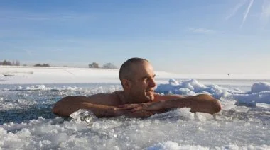 Two fit individuals doing a cold water immersion.