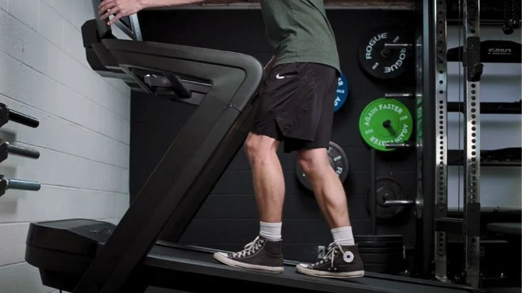 Our tester walking on an incline treadmill.