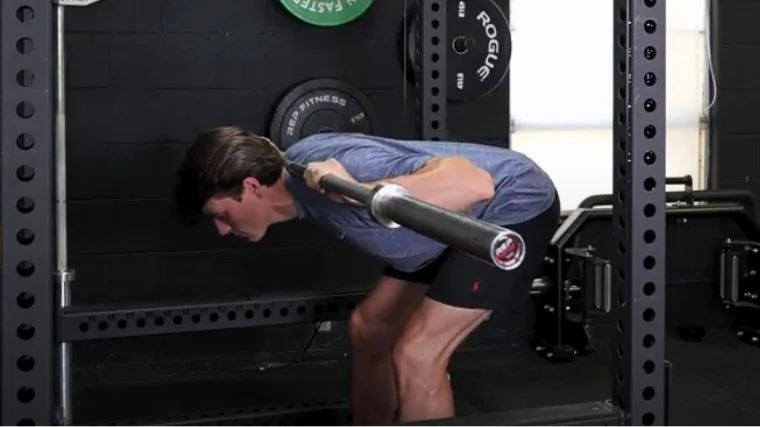 BarBend's Jake Herod performing the good morning exercise.