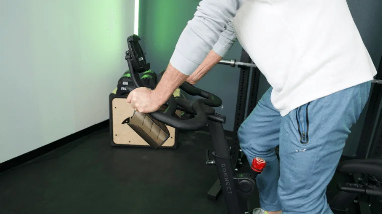 Our tester pedaling upright on the Echelon Connect EX-5 exercise bike.