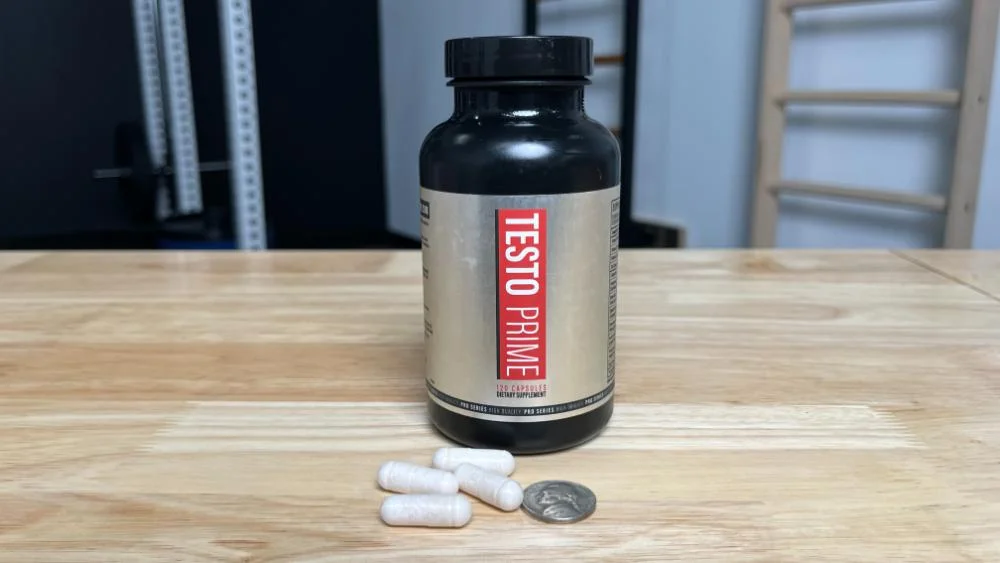 Pills and coin next to bottle of TestoPrime