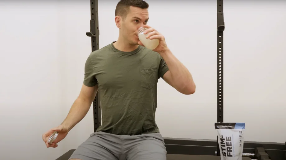 A BarBend tester drinking Transparent Stim-Free pre-workout.