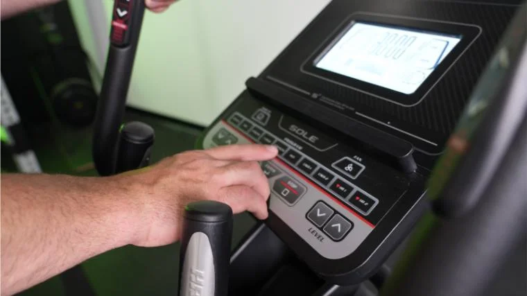 Our tester adjusting the controls on the similar Sole E25.