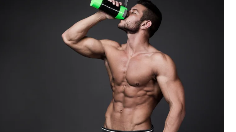 Athlete drinking protein/bcaa-rich shake.