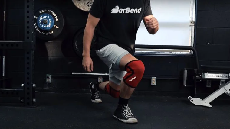 A person performing the lunge exercise.