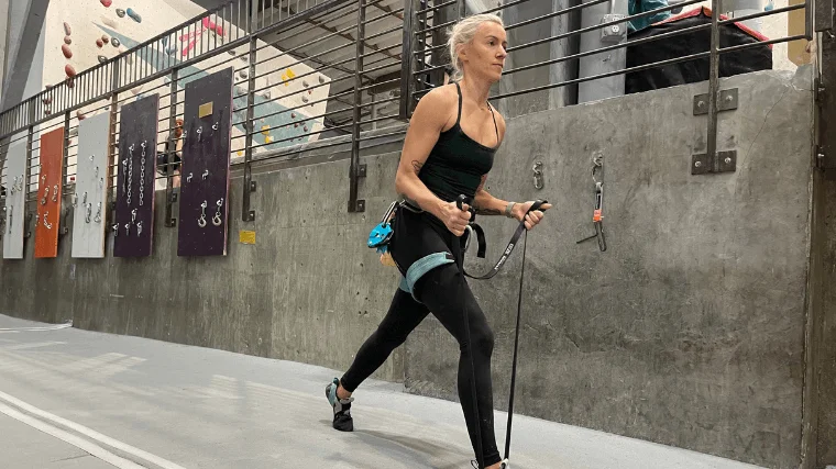 Woman does lunges with resistance band