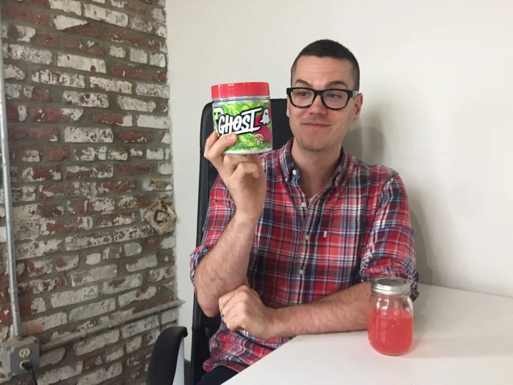 Our tester holding a container of Ghost Legend pre-workout