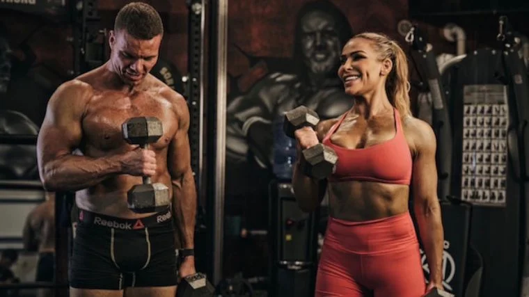 Natalya Neidhart performs biceps curls.