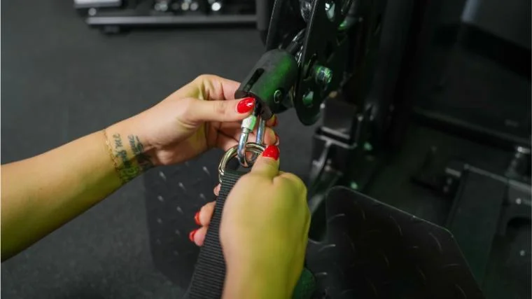 Our tester changing the handle on the Gronk Fitness Functional Trainer.