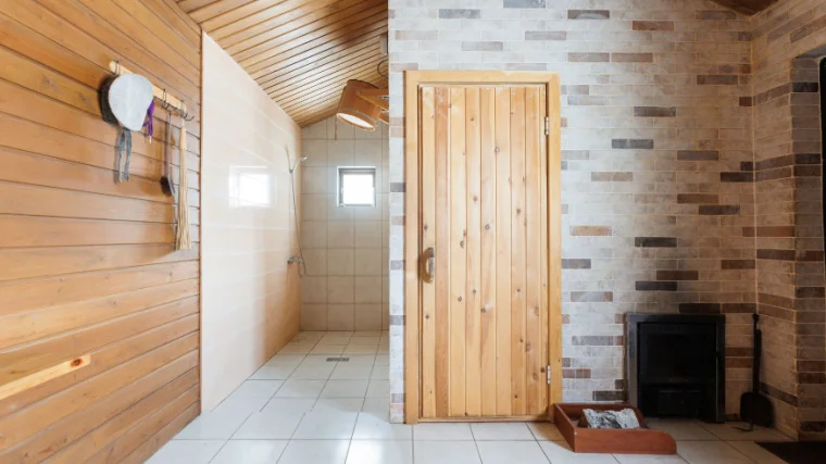 A steam room lined with wood.