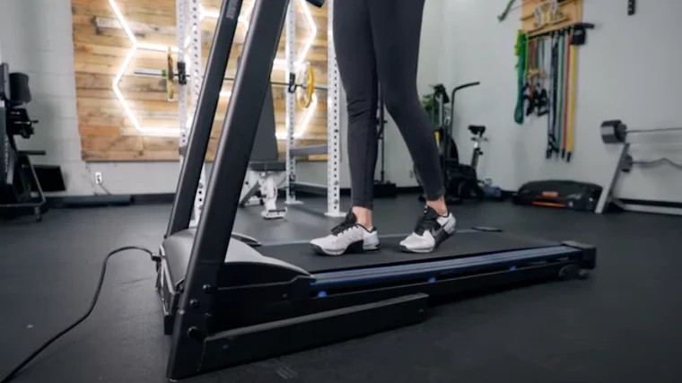 The lower half of a person can be seen walking on an XTerra TR150 treadmill