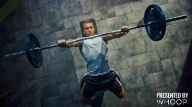 A man bench pressing from a top angle