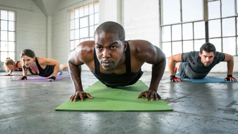 Four people doing yoga.