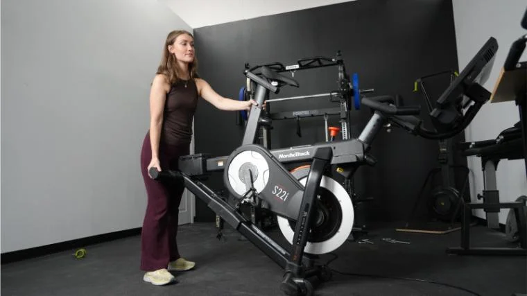 Our BarBend product tester moving the NordicTrack S22i.