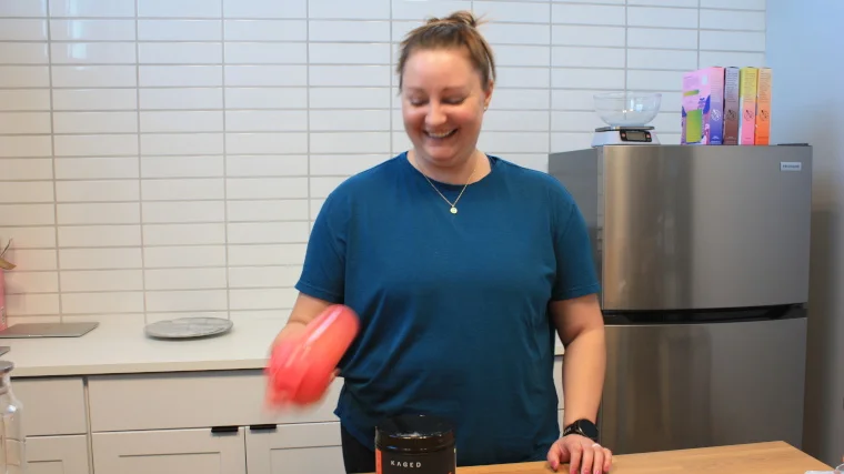 Our tester mixing a serving of Kaged Muscle Pre-Workout