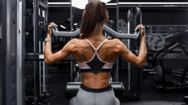 An athlete doing neutral-grip pulldowns in the gym.