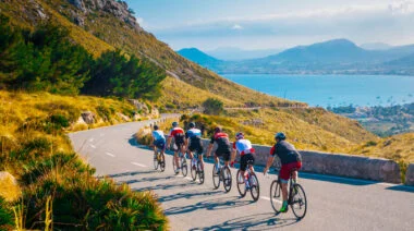 A group of people cycling in the daytime
